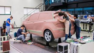 Although car design happens largely on the computer, clay models remain critical for assessing form, lines, and proportion.  Courtesy of GM