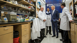 Vice President Joe Biden talking to scientists inside a Duke University School of Medicine Lab.